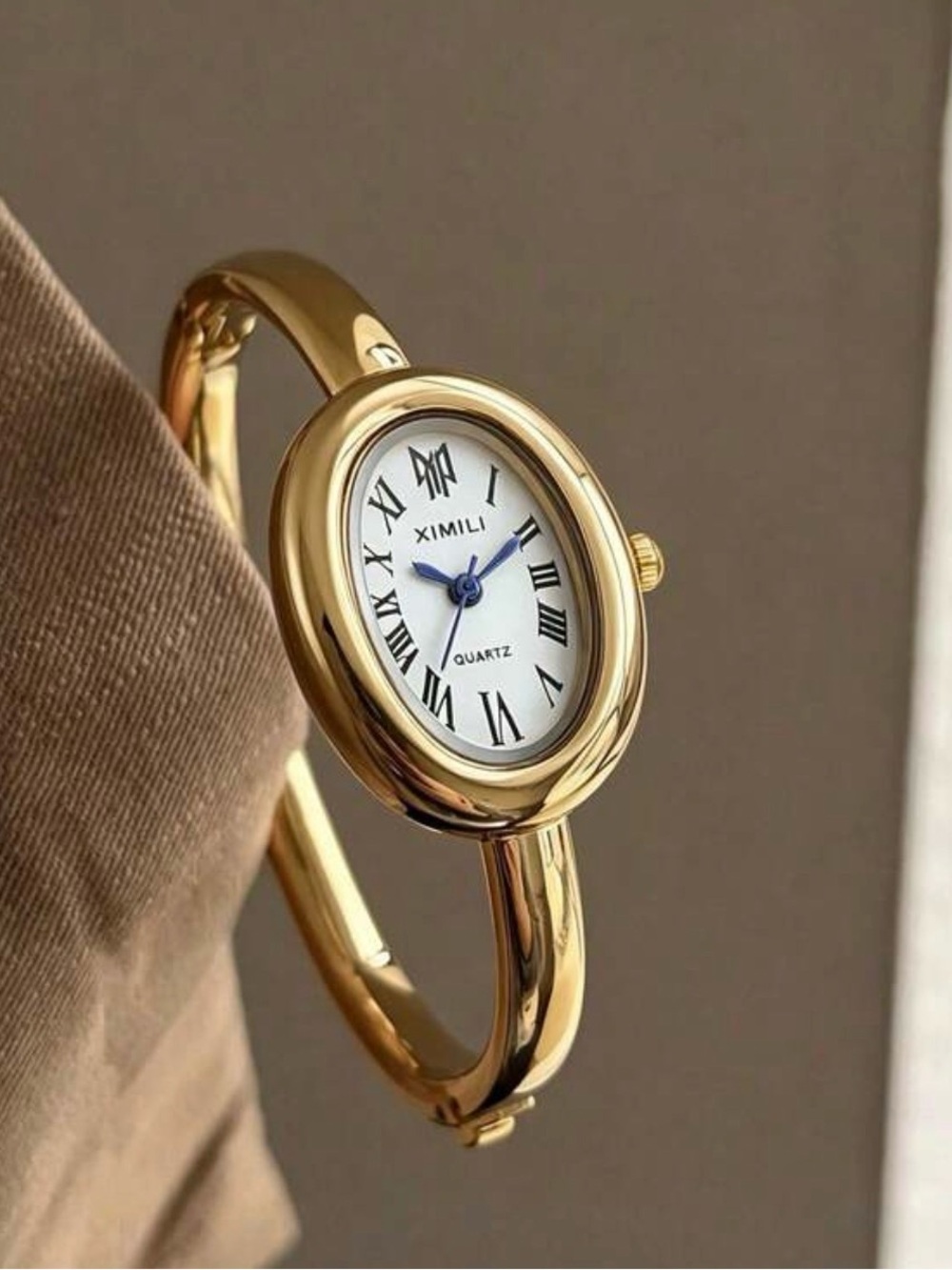 Women's Gold Oval Bangle Watch - Classic Roman Dial